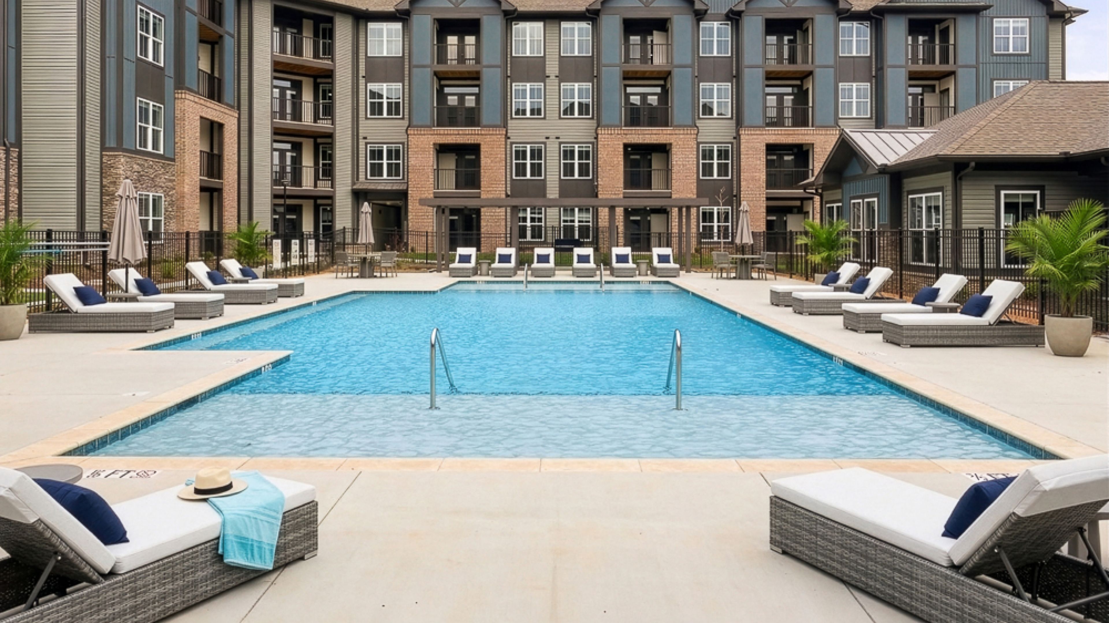 Hawthorne at Hixson palm leaves blowing in the wind against a blue sky